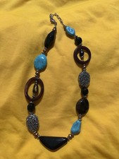 Bohemian-style beaded necklace featuring faux turquoise and tiger's eye