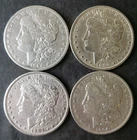 1884 O, 1900 O, 1901 O, and 1904 $1 Morgan Silver Dollars