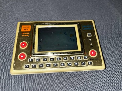Vintage Sinatron MG8 SHUTTLE VOYAGE LCD game /clock/calculator For Parts Only