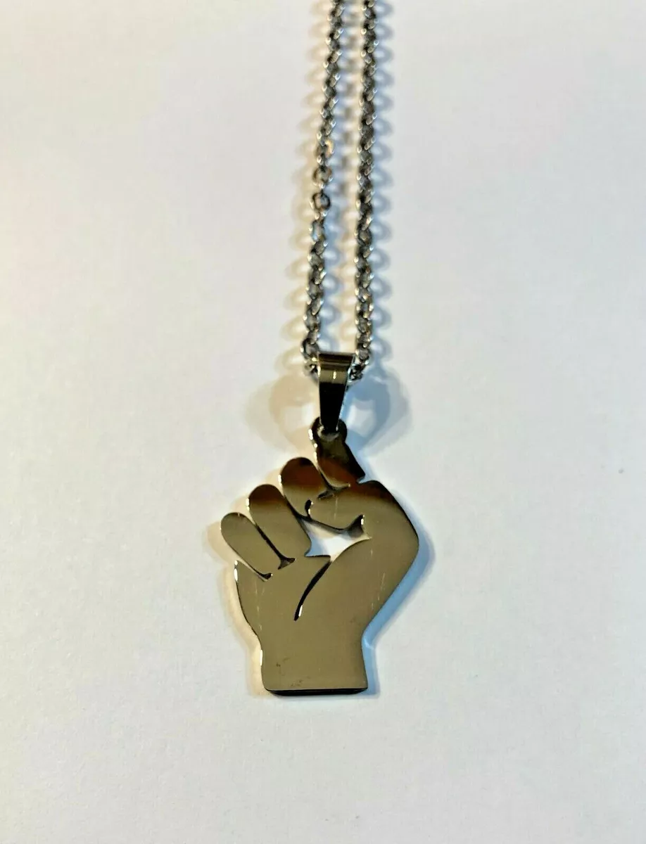 Raised fist pendant deals