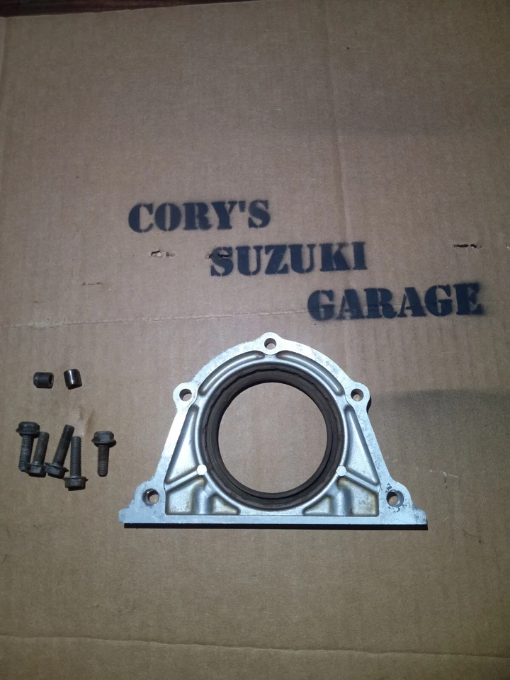 89-95 Geo Tracker/Suzuki Sidekick 1.6L 8v carcasa de sello de aceite trasero *OEM* Foto 2 de 2