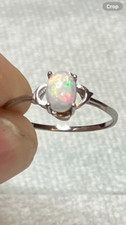  127B- .60ct Genuine Ethiopian Welo Opal set in a Size 9 Sterling Silver Ring