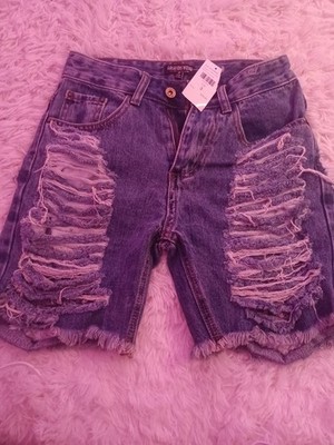 Fashion Nova Acting Nice Stretch Denim Bermuda Shorts in a medium wash.