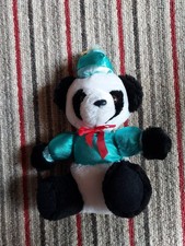 VIntage collectible 8" plush panda bear dressed in a festive outfit,