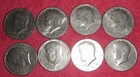 LOT OF (8) 1973 D Mint Kennedy half dollars, circulated in VG condition.