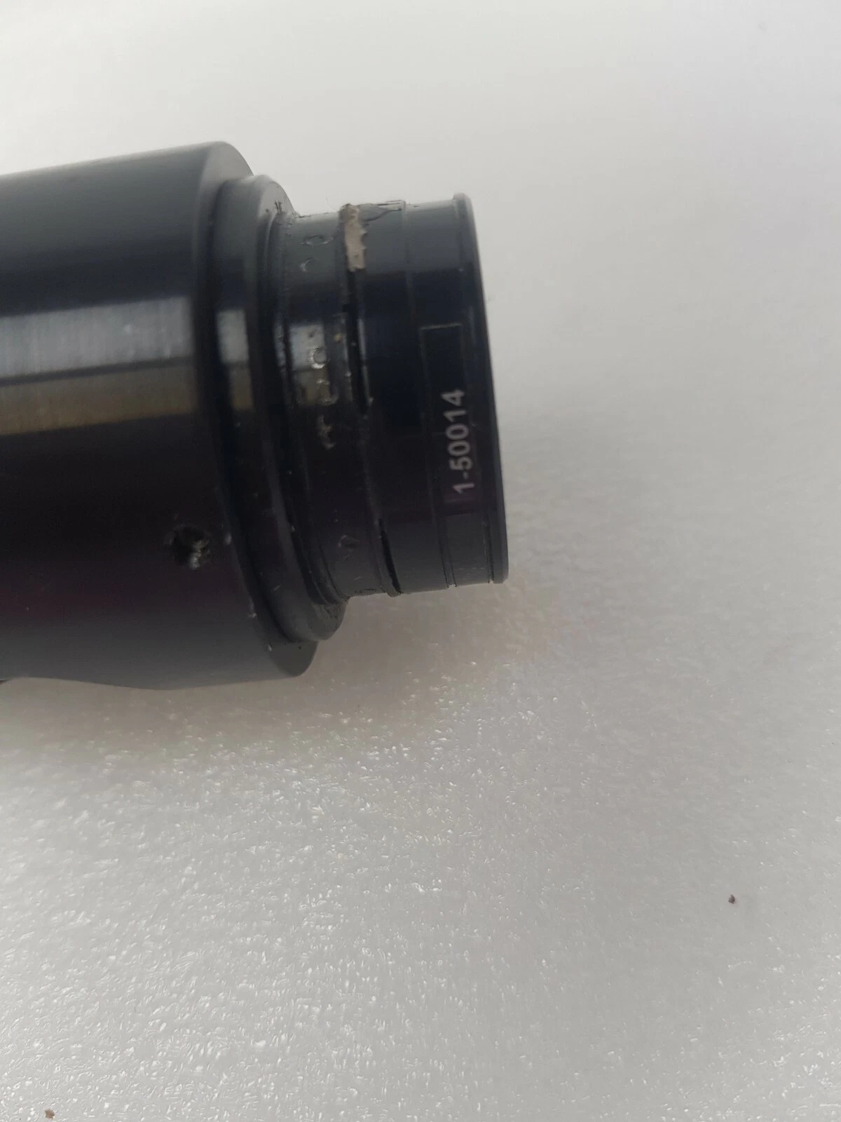 1-50014 marking on the Navitar lens attachment, with tape residue