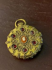 Vintage locket pendant featuring hinged design holding solid (used) perfume