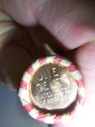 WHEAT PENNY ROLL WITH A UNKNOWN BU WHEAT PENNY SHOWING