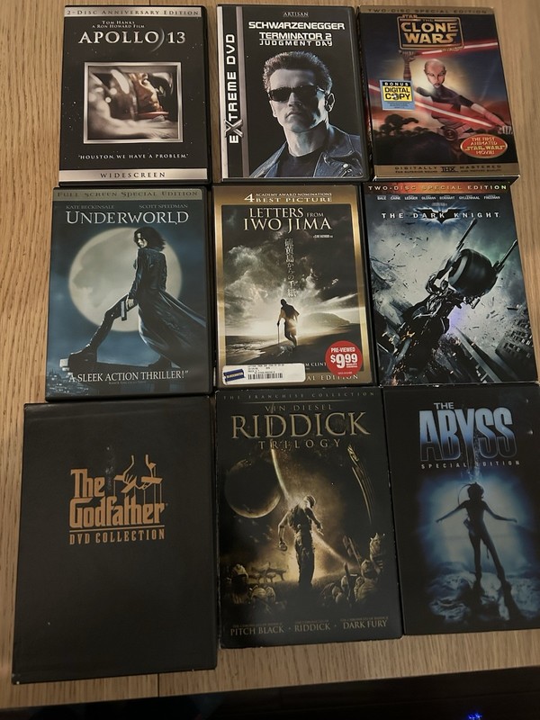 Lot of  9 DVD movies the Godfather Abyss Apollo 13  Terminator Batman etc