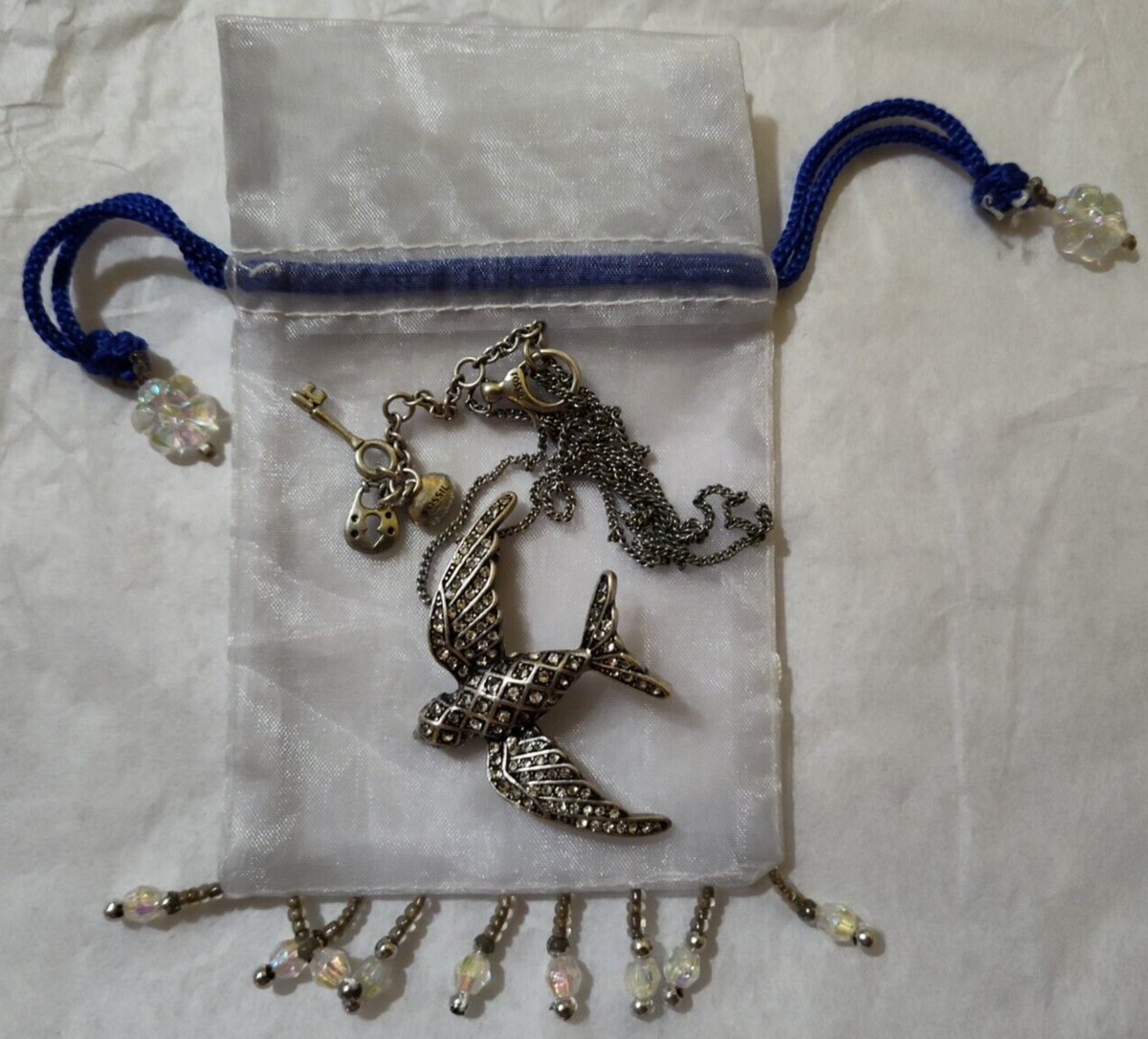 Fossil brand rhinestone bird pendant necklace stainless steel