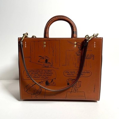 COACH x PEANUTS LIMITED EDITION HAZELNUT NEWSPRINT SNOOPY ROGUE