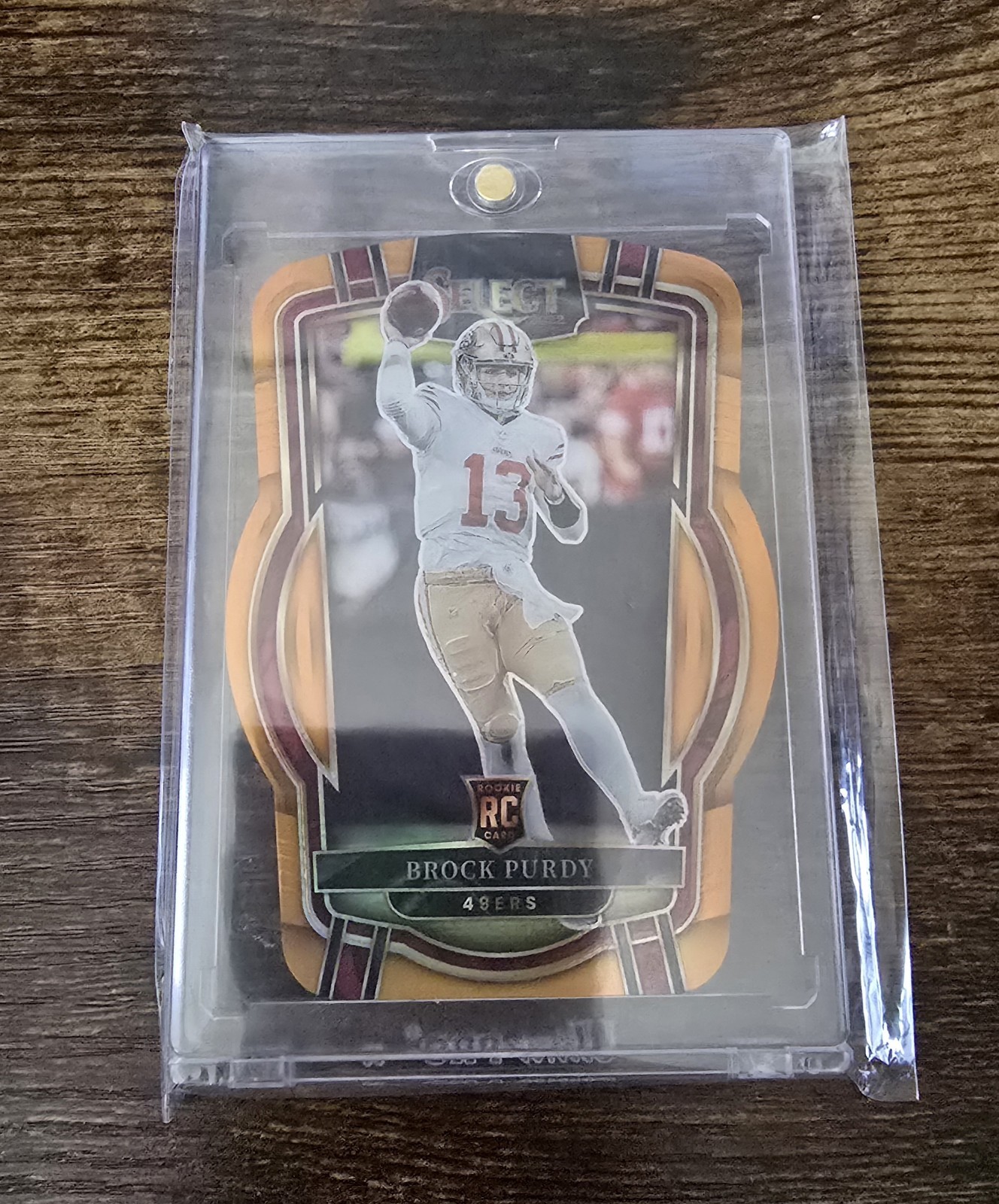 2022 Panini Select - Club Level Brock Purdy #213 Orange Prizm Die-Cut /199 (RC)