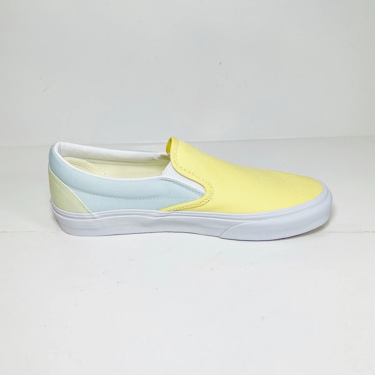 Pastel yellow hotsell vans slip on
