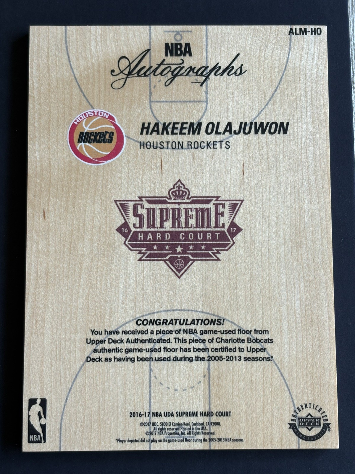 2016-17 Upper Deck UD Supreme Hard Court Hakeem Olajuwon NBA Logoman Auto /99 view 2