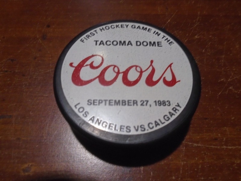 Hockey Puck from 1st Game in the Tacoma Dome 9/27/83. LA vs Calgary. EX.