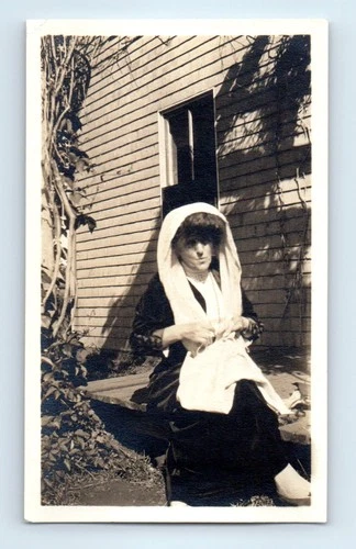 Old Vintage Photo SOLO WOMAN SITTING BY HOUSE TOWEL SCARF OVER HEAD SNAPSHOT
