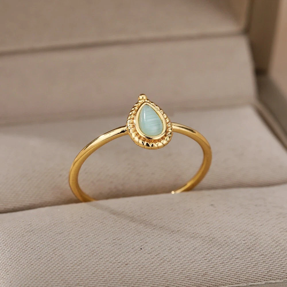 14K Yellow Gold Diamond and Oval Shape Blue Topaz Ladies Ring With Flower  Pattern J-Back and Black Enamel | Shop 14k Yellow Gold Lusso Color Rings |  Gabriel & Co