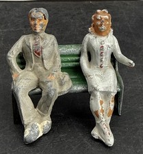 Manoil Happy Farm Man and Woman Sitting on a Bench Little Damage On Bench  Arm