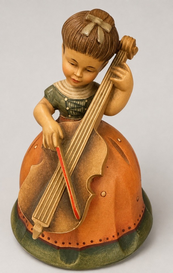 An ANRI Italy hand-carved rotating figure of a girl playing cello, powered by a Thorens Swiss movement — two legendary names in one stunning piece.