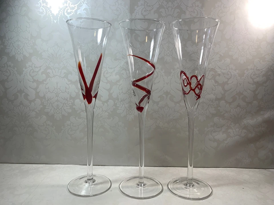 Set Of 3 Clear Swirline Glass Champagne Flutes Red Embossed Mixed Designs - Image 3 of 4