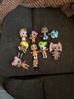 Mixed Lot of 9 Lol Surprise Dolls With A Bag Of Clothing Shoes And Other Items