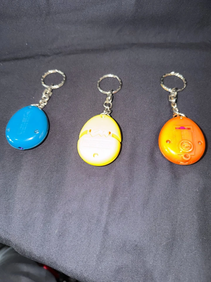 3 Vintage 1997 Tamagotchi McDonalds Bandai Keychains Lot - ORANGE/ YELLOW/ BLUE - Image 2 of 2