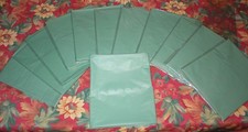 DISPOSABLE GREEN TABLE COVERS 54" X 108" LOT OF 12 SOLD AS IS