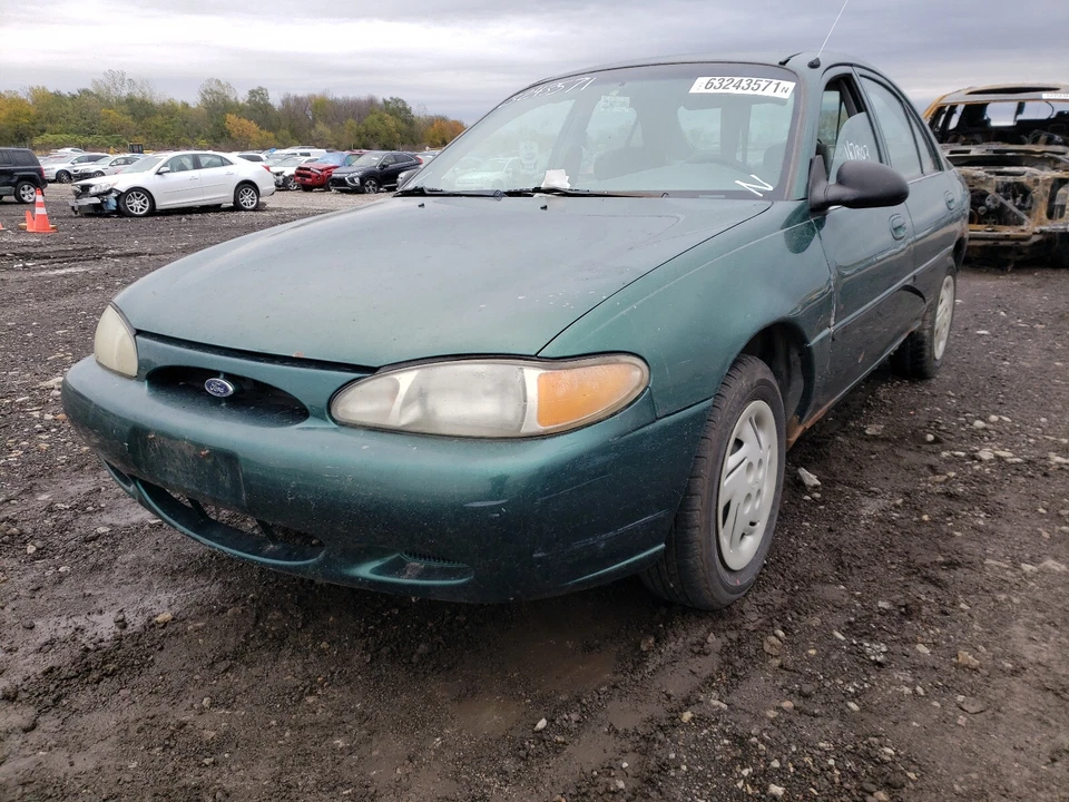 Ford Escort, Mercury Tracer 4 puertas: 1998, 1999, consola gris con portavasos Foto 3 de 4