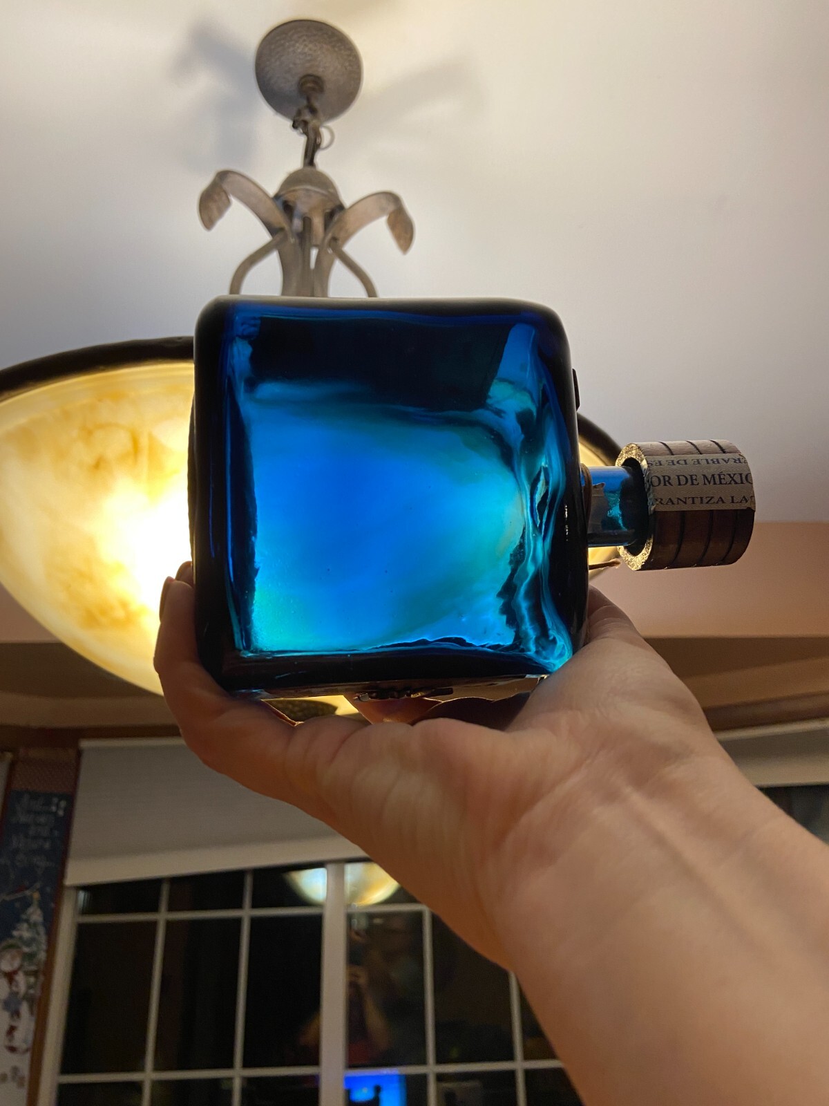 Los Arango special edition cobalt blue leather label tequila bottle