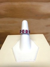 STERLING SILVER RING WITH RUBY COLORED STONES