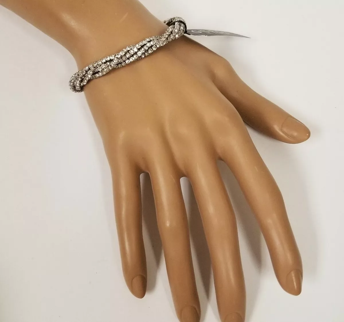 NEW GUESS SILVER TONE TWISTED CLEAR RHINESTONE STRETCH CUFF BRACELET