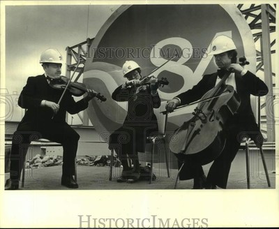 1983 Press Photo Musicians Wear Hard Hats, Play String Instruments, World's Fair