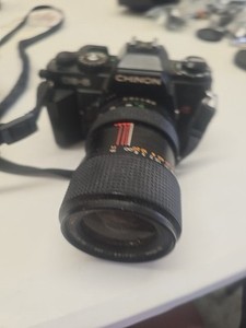 Chinon CE-5 35mm SLR film camera with a Chinon Zoom MC Macro 35-80mm lens. **