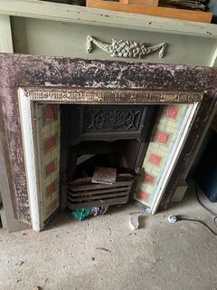 CAST IRON FIRE SURROUND WITH TILE INLAY