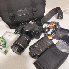 Canon EOS Kiss X5 DSLR Camera with Speedlite Lens and 5 Batteries Set