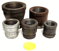 ASSORTED LOT OF COUPLINGS IN VARIOUS SIZES STEEL CAST IRON LOT OF 5