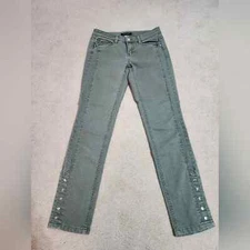 White House Black Market sage colored jeans with jewel and snap details