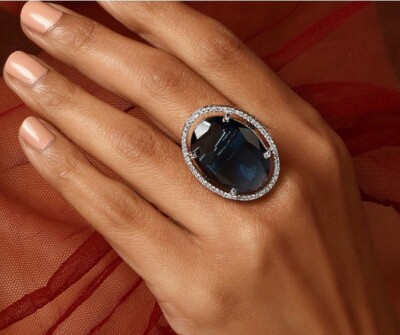 Single Halo Design With Oval Round Cut Simulated Sapphire