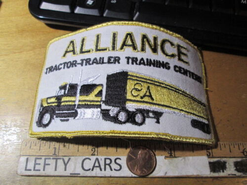 ALLIANCE TRACTOR TRAILER TRAINING CENTERS EMBROIDERED CLOTH VINTAGE CURVE PATCH  - Picture 1 of 2