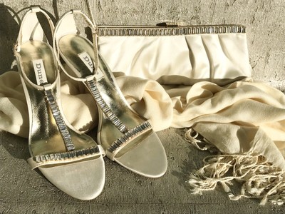 gold heels and clutch bag