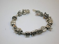 PULSERA PANDORA VINTAGE PLATA ESTERLINA CON 18 DIJES (ALE) HASTA 7 1/2" MUÑECA