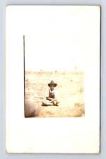 RPPC Boy Sitting on Ground on a Farm in Overalls Real Photo Postcard