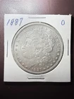 1887-O Morgan Silver Dollar New Orleans Mint AU Raw