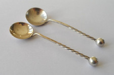Pair of antique silver condiment spoons with ball finials & twisted style stems.