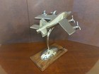 Vintage Chrome Model of a Jet Plane on a Polished Wooden Base