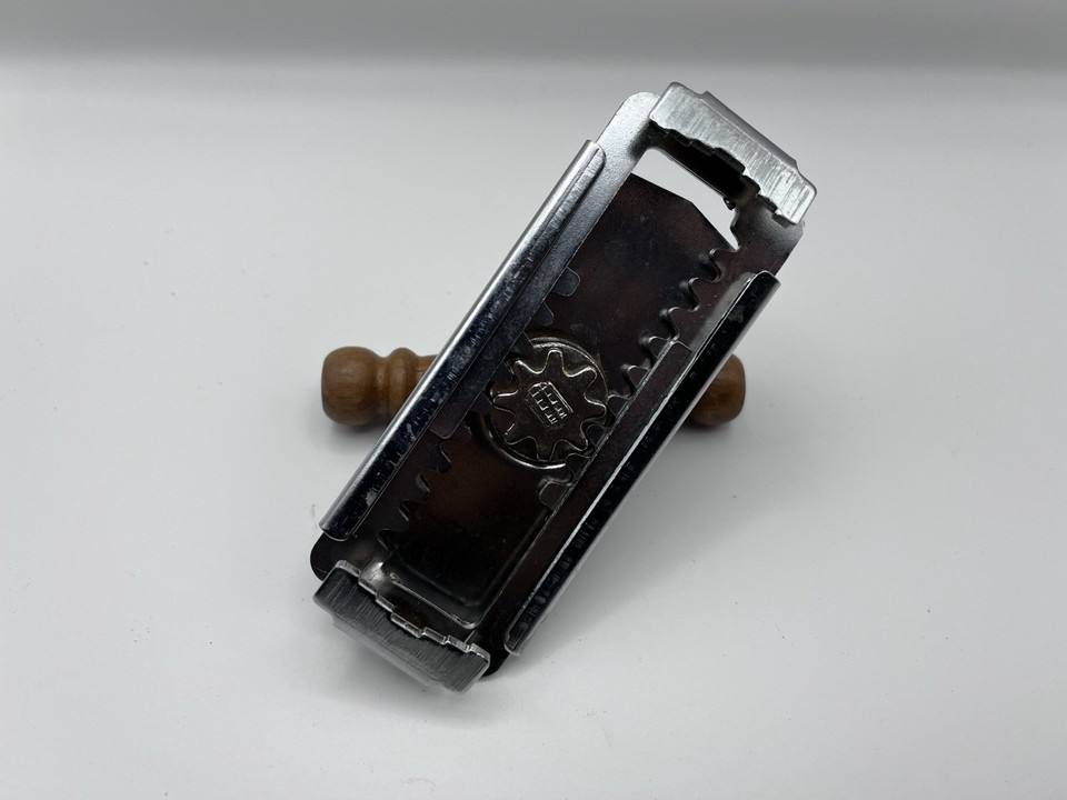 This Travco adjustable jar opener with a wood handle is the kind of elegant, well-made retro tool that makes modern rubber gadgets look embarrassing.