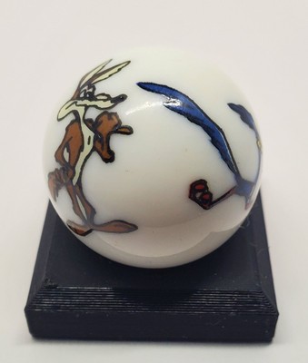Wile E. Coyote & Roadrunner 1'' Glass Logo Marble w/ Colored Stand