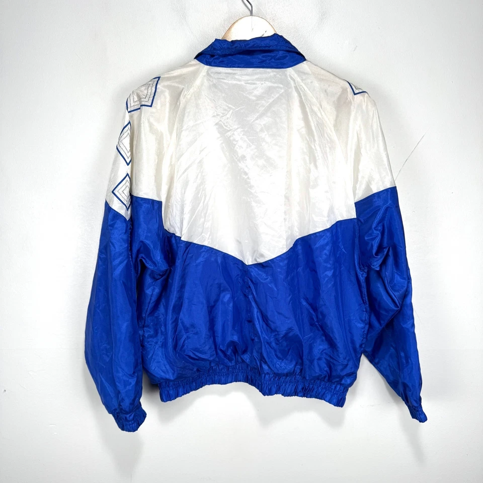 Chaqueta cortavientos Reebok vintage para mujer mediana blanca azul plateada años 90 cremallera completa Foto 2 de 4