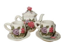 Vintage miniature pottery child's tea set with garden roses design