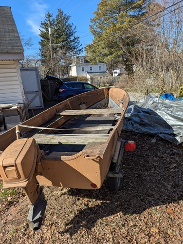 14 foot aluminum johnboat. 15 HP Evinrude Motor, runs well. Load Rite Trailer